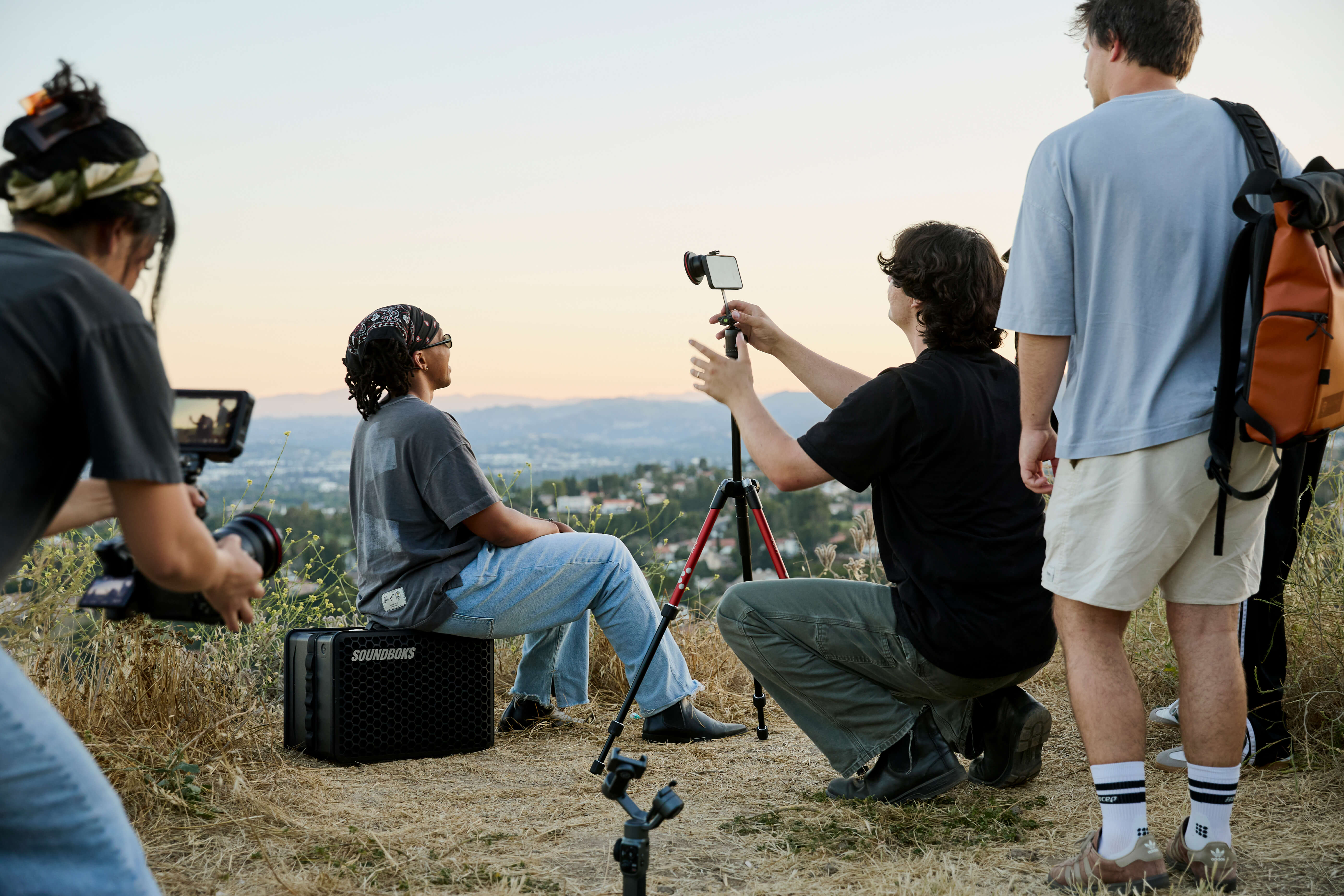Creators outdoors with cameras — Moment Creators hero